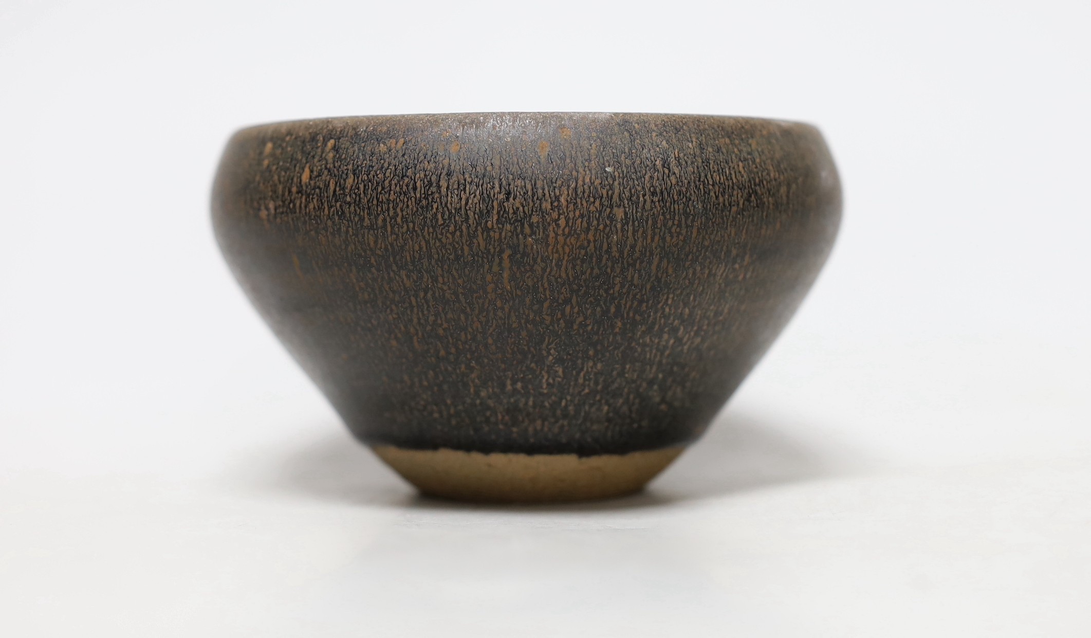 A Chinese brown pottery bowl, 11.5cms diameter